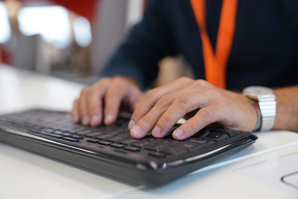 Man typing on a keyboard